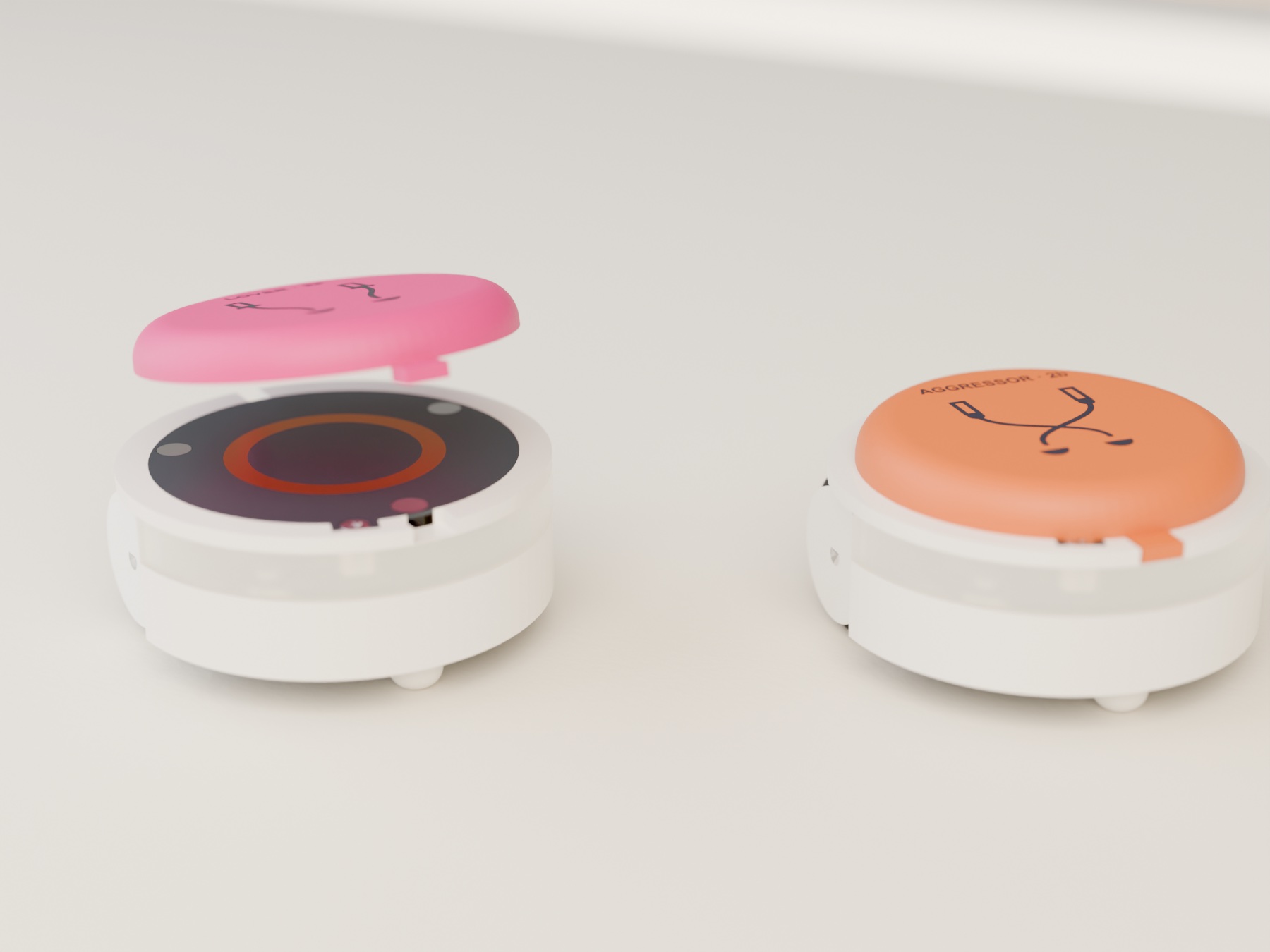 A pink Lover hat being set onto a bot, its keys lined up with the slots; beside it a finished bot with the printed AGGRESSOR · 2b hat.