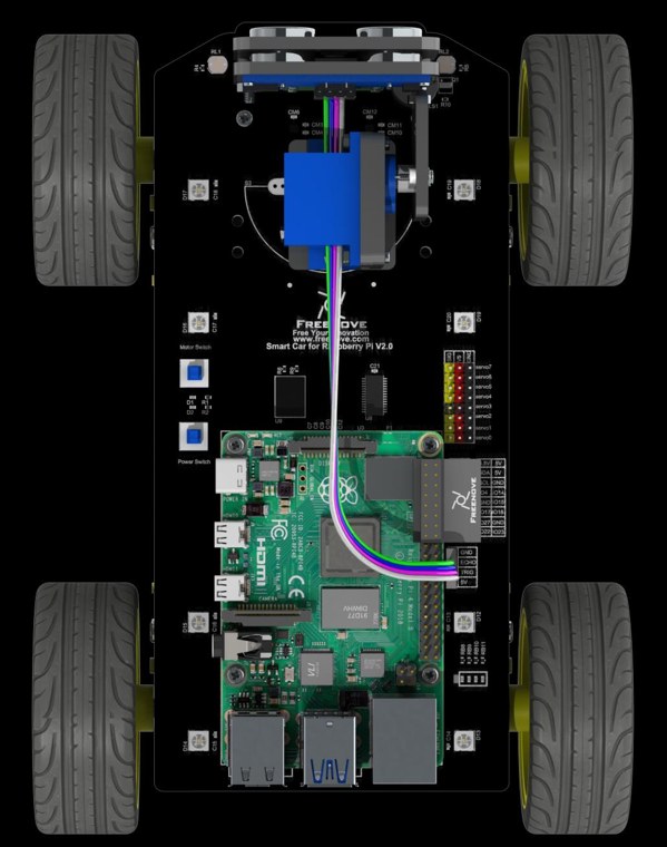 Top-down view of the same robot, showing the Raspberry Pi, the servo, the wiring loom and the four motors.